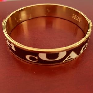 Gold and brown coach bracelet